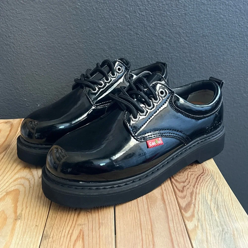 All black leather platform low top laced up boots